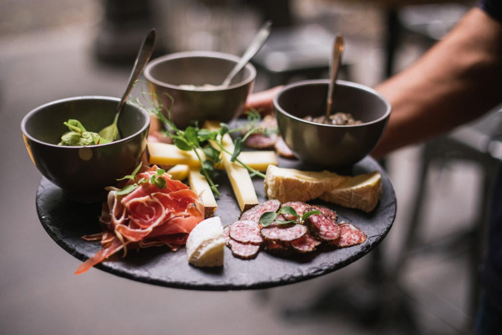 Arm holding a charcuterie board