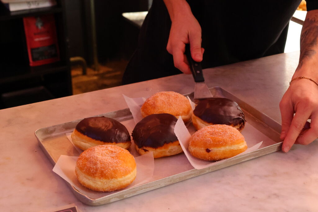 a pile of Sammy's Berliner donuts is served on an Eating Europe food tour