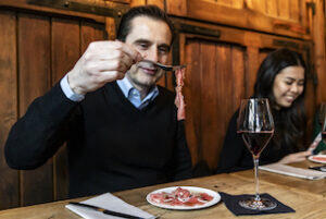 man_eating_a_dish_on_a_food_tour