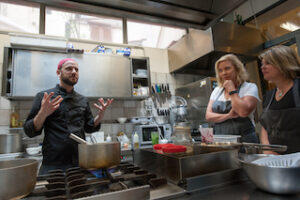 chef_teaching_people_on_an_Eating_Europe_cooking_class_in_Italy